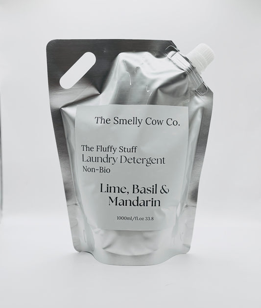 A silver pouch with a minimalist label containing laundry detergent, scented in lime, basil and mandarin.