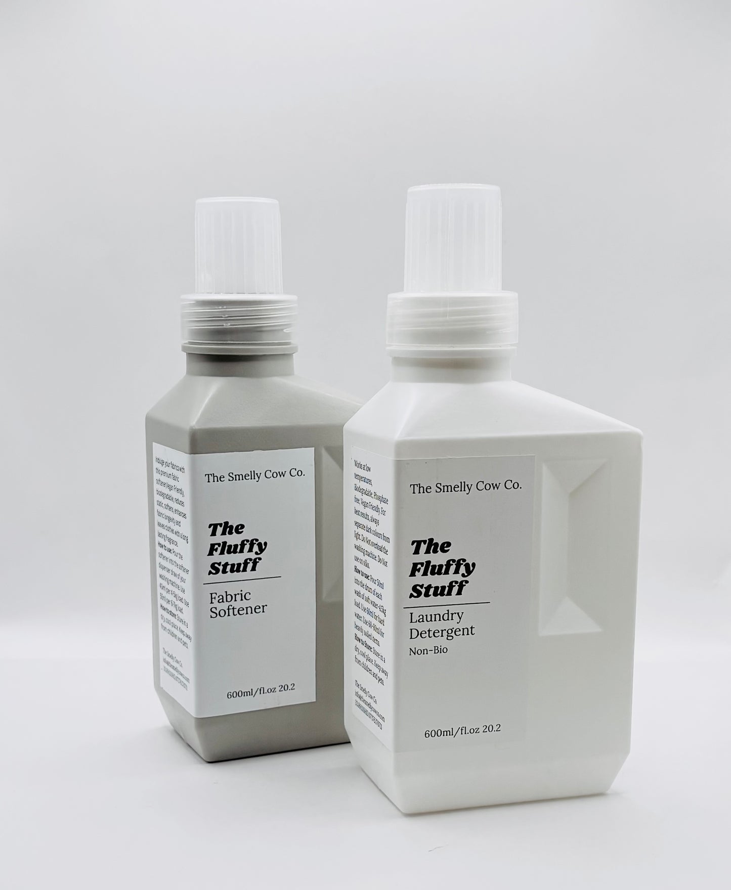 A white and grey square bottle, measuring 600ml each and used to refill laundry detergent and fabric conditioner.