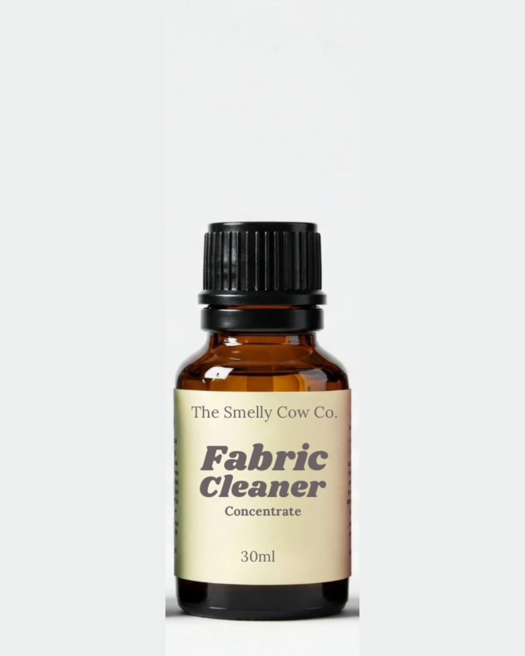 A 30ml glass amber bottle with fabric cleaner concentrate inside.